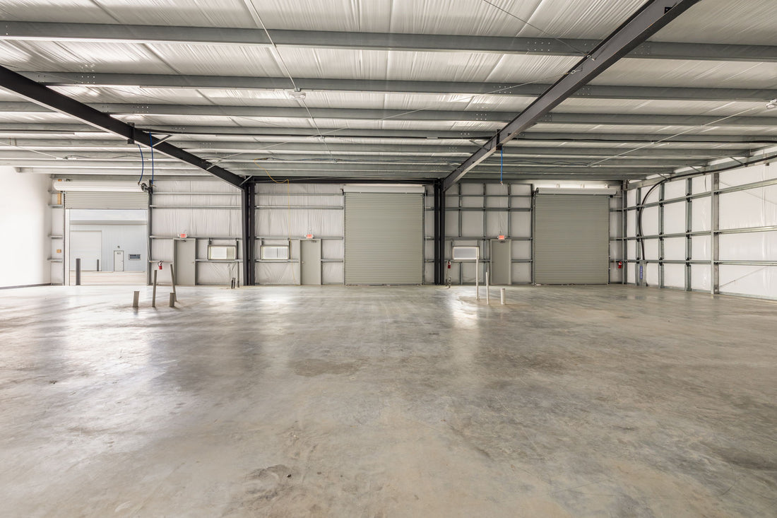 Interior of combined flex warehouse suites showing clear height and multiple roll-up doors at Dacy Business Park
